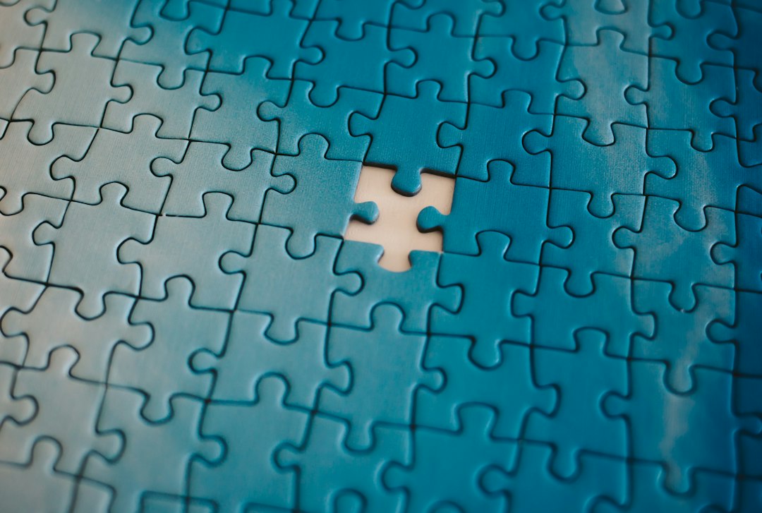 A close-up of a jigsaw puzzle with a missing piece, symbolizing the concept of connections and completion.